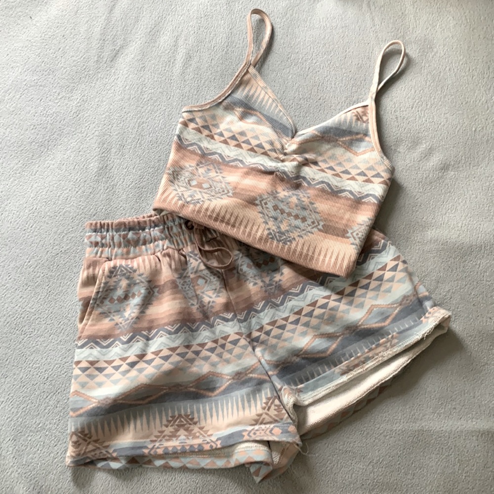 Women's matching tank crop and sweat shorts.